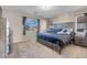 King-size bed with gray wooden frame and dresser at 6461 Karlsen Ct, Las Vegas, NV 89122