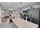 Modern kitchen with gray cabinets and black appliances at 6461 Karlsen Ct, Las Vegas, NV 89122