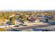 Aerial view of single story home with pool, and Las Vegas skyline in background at 6480 Darby Ave, Las Vegas, NV 89146