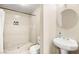 Clean bathroom with shower stall, toilet, and pedestal sink at 6480 Darby Ave, Las Vegas, NV 89146