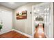 Bright entryway with wood-look floors, leading to a bedroom with a view at 6480 Darby Ave, Las Vegas, NV 89146