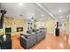 Bright living room with hardwood floors and a stone fireplace at 6480 Darby Ave, Las Vegas, NV 89146