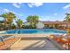 Relaxing rectangular pool with lounge chairs and patio area at 6480 Darby Ave, Las Vegas, NV 89146