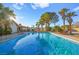 Inviting rectangular pool with lounge chairs and palm trees at 6480 Darby Ave, Las Vegas, NV 89146