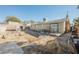 Backyard view of house showing a shed and unfinished patio at 6770 Laronda Ln, Las Vegas, NV 89156