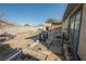 Backyard with wooden deck and shed, showing potential for landscaping at 6770 Laronda Ln, Las Vegas, NV 89156