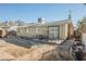 Backyard view of house showing a shed and unfinished patio at 6770 Laronda Ln, Las Vegas, NV 89156