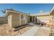 Front entrance with wood door and sidelights at 6770 Laronda Ln, Las Vegas, NV 89156