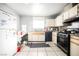 Kitchen with white cabinets and appliances at 6770 Laronda Ln, Las Vegas, NV 89156