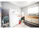 Kitchen features white cabinets and refrigerator at 6770 Laronda Ln, Las Vegas, NV 89156