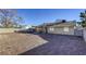 Large backyard with gravel and a covered patio at 6812 Greydawn Dr, Las Vegas, NV 89108