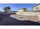 Large backyard with gravel and block wall at 6812 Greydawn Dr, Las Vegas, NV 89108