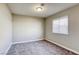 Bright bedroom with neutral walls and carpet at 6812 Greydawn Dr, Las Vegas, NV 89108