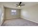 Bright bedroom with ceiling fan and carpet flooring at 6812 Greydawn Dr, Las Vegas, NV 89108