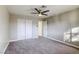 Bedroom with double door closet and ceiling fan at 6812 Greydawn Dr, Las Vegas, NV 89108