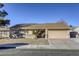 House exterior with a beige finish and a two-car garage at 6812 Greydawn Dr, Las Vegas, NV 89108