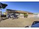 House exterior with a beige finish and a two-car garage at 6812 Greydawn Dr, Las Vegas, NV 89108