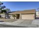 House exterior with a beige finish and a two-car garage at 6812 Greydawn Dr, Las Vegas, NV 89108