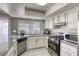 Modern kitchen with granite countertops and stainless steel appliances at 6812 Greydawn Dr, Las Vegas, NV 89108