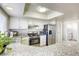 Modern kitchen featuring granite countertops and stainless steel appliances at 6812 Greydawn Dr, Las Vegas, NV 89108