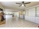 Spacious living room with fireplace and kitchen access at 6812 Greydawn Dr, Las Vegas, NV 89108