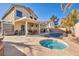 Large backyard with a pool, spa, and patio area at 716 Amber Hills Dr, Las Vegas, NV 89123