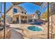 Inviting backyard with a sparkling pool, spa, and covered patio at 716 Amber Hills Dr, Las Vegas, NV 89123