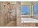 Clean bathroom with shower and tub, featuring tiled walls at 716 Amber Hills Dr, Las Vegas, NV 89123