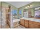 Bathroom boasts double sinks, shower, and a relaxing bathtub at 716 Amber Hills Dr, Las Vegas, NV 89123