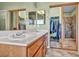 Double vanity bathroom with adjacent closet and shower at 716 Amber Hills Dr, Las Vegas, NV 89123