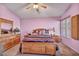 Primary bedroom with king-size bed and wood dresser at 716 Amber Hills Dr, Las Vegas, NV 89123