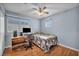 Bedroom with wood floors and ceiling fan at 716 Amber Hills Dr, Las Vegas, NV 89123