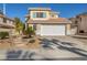 Two-story house with landscaped yard, two-car garage, and sunlit exterior at 716 Amber Hills Dr, Las Vegas, NV 89123