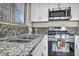 Kitchen boasts granite countertops and stainless steel appliances at 716 Amber Hills Dr, Las Vegas, NV 89123