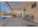 Covered patio with seating for outdoor dining at 716 Amber Hills Dr, Las Vegas, NV 89123