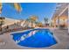 Refreshing blue swimming pool with a large patio at 716 Amber Hills Dr, Las Vegas, NV 89123