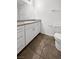 Clean bathroom with white cabinets and granite countertops at 7355 Sunray Point St, North Las Vegas, NV 89084