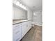 Modern bathroom with granite countertop and walk-in shower at 7355 Sunray Point St, North Las Vegas, NV 89084