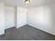 Spacious bedroom with double door closet and gray carpet at 7355 Sunray Point St, North Las Vegas, NV 89084