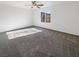 Spacious bedroom with grey carpet and ample natural light at 7355 Sunray Point St, North Las Vegas, NV 89084