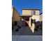 Modern two-story home with red door and landscaped yard at 7355 Sunray Point St, North Las Vegas, NV 89084