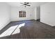 Spacious living room with gray carpet and lots of natural light at 7355 Sunray Point St, North Las Vegas, NV 89084