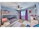 Cozy bedroom with bunk beds, purple curtains, and a vanity at 8125 Caramel Gorge Ct, Las Vegas, NV 89143