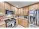 Kitchen with stainless steel appliances and wood cabinets at 8125 Caramel Gorge Ct, Las Vegas, NV 89143