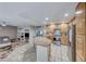 Open concept kitchen with island, granite counters, and stainless steel appliances at 8125 Caramel Gorge Ct, Las Vegas, NV 89143