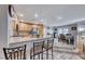 Open kitchen with island, granite countertops, and stainless steel appliances at 8125 Caramel Gorge Ct, Las Vegas, NV 89143