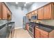 Kitchen with wood cabinets, granite countertops and stainless steel appliances at 8805 Jeffreys St # 2019, Las Vegas, NV 89123