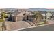 Single-story home with a landscaped yard and mountains in the background at 9802 Summer Bliss Ave, Las Vegas, NV 89149