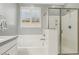 Clean bathroom with a shower and bathtub, offering ample space at 9802 Summer Bliss Ave, Las Vegas, NV 89149