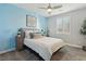 Charming bedroom with light blue accent wall and modern decor at 9802 Summer Bliss Ave, Las Vegas, NV 89149